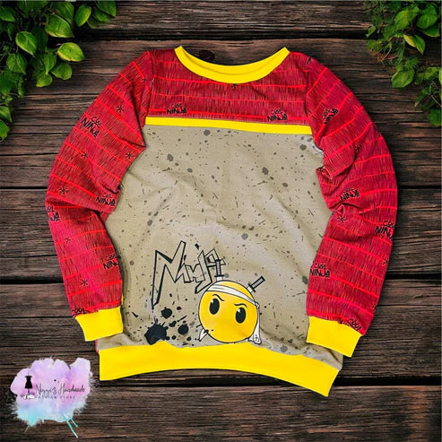 Weiches Bio Baumwoll French Terry Stoff Panel von Niggis Handmade mit dem Design "NinjaSmiley" von GroWidesign zum vernähen. Ideal für Sweatjacken, Hoodies oder andere Kleidungsstücke.